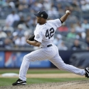 New York Yankees relief pitcher Mariano Rivera (42) delivers in the ninth inning of a baseball game against the San Francisco Giants, Sunday, Sept. 22, 2013, in New York. (AP Photo/Kathy Willens)
