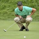 Scott Piercy of the U.S. studies his putt on the ninth hole during the first round at the Canadian Open golf tournament at Hamilton Golf and Country Club in Ancaster Ontario, July 26, 2012. REUTERS/ Mike Cassese