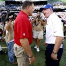Tampa Bay Buccaneers head coach Greg Schiano, left, and New York Giants head coach Tom Coughlin exchange words at the end of an NFL football game Sunday, Sept. 16, 2012, in East Rutherford, N.J. The Giants won the game 41-34. (AP Photo/Julio Cortez)