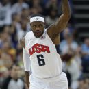 USA's Lebron James reacts after scoring against Australia during a quarterfinal men's basketball game at the 2012 Summer Olympics, Wednesday, Aug. 8, 2012, in London. (AP Photo/Eric Gay)