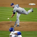 CORRECTS TO ADRIAN GONZALEZ, NOT LUIS CRUZ - San Diego Padres starting pitcher Eric Stults, top, throws to Los Angeles Dodgers' Adrian Gonzalez during the first inning of their baseball game, Monday, April 15, 2013, in Los Angeles. (AP Photo/Mark J. Terrill)