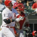 Chicago White Sox's A.J. Pierzynski, left, watches after hitting his two-run home run as Los Angeles Angels catcher Bobby Wilson looks on during the seventh inning of a baseball game in Chicago, Sunday, Aug. 5, 2012. The White Sox won 4-2. (AP Photo/Nam Y. Huh)