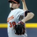 Baltimore Orioles pitcher Jason Hammel works the mound against the Atlanta Braves during the first inning of a baseball game on Saturday, June 16, 2012, in Atlanta. (AP Photo/John Amis)