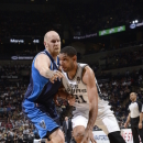 SAN ANTONIO, TX - MARCH 14: Tim Duncan #21 of the San Antonio Spurs drives to the basket against the Dallas Mavericks on March 14, 2013 at the AT&T Center in San Antonio, Texas