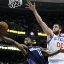 Charlotte Bobcats' Kemba Walker (15) drives past Philadelphia 76ers' Spencer Hawes (00) during the first half of an NBA basketball game, Saturday, Feb. 9, 2013, in Philadelphia. (AP Photo/Michael Perez)