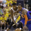 Indiana Pacers' Paul George (24) and New York Knicks' J.R. Smith (8) battle for a loose ball during the second half of Game 3 of an Eastern Conference semifinal NBA basketball playoff series on Saturday, May 11, 2013, in Indianapolis. Indiana defeated New York 82-71. (AP Photo/Darron Cummings)