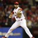 St. Louis Cardinals relief pitcher Edward Mujica works during the ninth inning of Game 5 of baseball's National League championship series against the San Francisco Giants, Friday, Oct. 19, 2012, in St. Louis. (AP Photo/Jeff Roberson)