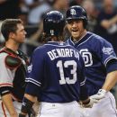 San Diego Padres' Chase Headley is congratulated by Chris Denorfia after hitting a two-run home run against the San Francisco Giants during the third inning of a baseball game Saturday, Sept. 29, 2012 in San Diego. (AP Photo/Lenny Ignelzi)
