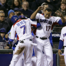 The Dominican Republic's Jose Reyes (7) celebrates with Nelson Cruz (17) after scoring against the Netherlands during the fifth inning of a semifinal game of the World Baseball Classic in San Francisco, Monday, March 18, 2013. (AP Photo/Eric Risberg)