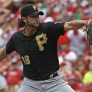 Pittsburgh Pirates relief pitcher Jason Grilli throws against the Cincinnati Reds in the ninth inning of a baseball game, Sunday, July 21, 2013, in Cincinnati. Pittsburgh won 3-2 with Grilli picking up his 30th save. (AP Photo/Al Behrman)