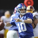 New York Giants quarterback Eli Manning (10) looks to pass during the first half of an NFL football game against the Washington Redskins Sunday, Oct. 21, 2012 in East Rutherford, N.J. (AP Photo/Bill Kostroun)