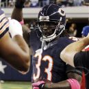 Chicago Bears cornerback Charles Tillman celebrates after returning an interception for a touchdown during the first half of an NFL football game against the Dallas Cowboys, Monday, Oct. 1, 2012, in Arlington, Texas. (AP Photo/Tony Gutierrez)