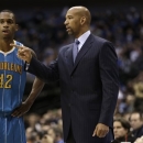 New Orleans Hornets head coach Monty Williams, right, talks with forward Lance Thomas (42) during the first half of an NBA basketball game against the Dallas Mavericks Saturday, Jan. 5, 2013, in Dallas. (AP Photo/LM Otero)