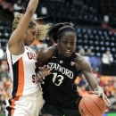 Stanford forward Chiney Ogwumike, right, drives against Oregon State guard Jasmine Camp during the first half of an NCAA college basketball game in Corvallis, Ore., Sunday, Feb. 3, 2013. (AP Photo/Don Ryan)