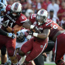 South Carolina running back Mike Davis (28) carries the ball for short yardage during the first half of an NCAA college football game against North Carolina, Thursday, Aug. 29, 2013, in Columbia, S.C. (AP Photo/Stephen Morton)
