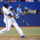 Toronto Blue Jays' Edwin Encarnacion hits a one out double against the Houston Astros during the fifth inning of a baseball game, Friday, July 26, 2013, in Toronto. (AP Photo/The Canadian Press, Jon Blacker)