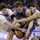 Boise State's Anthony Drmic, center, struggles for the ball against Creighton's Doug McDermott, left, and Avery Dingman during the second half of an NCAA college basketball game in Omaha, Neb., Wednesday, Nov. 28, 2012. (AP Photo/Nati Harnik)