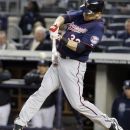 Minnesota Twins' Justin Morneau (33) hits a two-run home run against the New York Yankees at Yankee Stadium in New York, Wednesday, April 18, 2012. (AP Photo/Frank Franklin II)