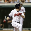 Cleveland Indians' Jason Kipnis watches his ball after hitting a two-RBI single off Minnesota Twins relief pitcher Brian Duensing in the seventh inning of a baseball game on Friday, June 21, 2013, in Cleveland. John McDonald and Michael Bourn scored. (AP Photo/Tony Dejak)