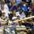 Milwaukee Brewers' Corey Hart breaks his bat as he hits a single during the sixth inning of a baseball game against the Pittsburgh Pirates Friday, Aug. 31, 2012, in Milwaukee. (AP Photo/Morry Gash)