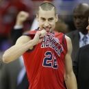 Mississippi guard Marshall Henderson (22) celebrates after a second-round game against Wisconsin in the NCAA college basketball tournament at the Sprint Center in Kansas City, Mo., Friday, March 22, 2013. Mississippi defeated Wisconsin 57-46.(AP Photo/Orlin Wagner)