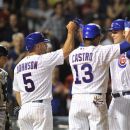 Pittsburgh Pirates catcher Michael McKenry reacts as Chicago Cubs' Reed Johnson (5) and Starlin Castro (13) congratulate Anthony Rizzo after his three-run home run during the fifth inning of a baseball game, Monday, July 30, 2012, in Chicago. (AP Photo/Jim Prisching)