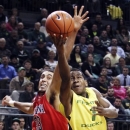 Arizona's Grant Jerrett (33) defends against a shot by Oregon's Dominic Artis during the second half of their NCAA college basketball game, Thursday, Jan. 10, 2013, in Eugene, Ore. Oregon won 70-66. (AP Photo/Chris Pietsch)