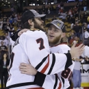 Chicago Blackhawks defenseman Brent Seabrook (7) and right wing Patrick Kane (88) celebrate the Stanley Cup after the Blackhawks beat the Boston Bruins 3-2 in Game 6 of the NHL hockey Stanley Cup Finals Monday, June 24, 2013, in Boston. (AP Photo/Elise Amendola)
