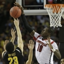 Louisville's Gorgui Dieng shoots over Wichita State's Fred Van Vleet during the second half of the NCAA Final Four tournament college basketball semifinal game Saturday, April 6, 2013, in Atlanta. (AP Photo/David J. Phillip)