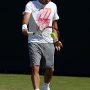 LONDON, ENGLAND - JUNE 24:  Roger Federer of Switzerland in action in a practice session during previews for the Wimbledon Championships 2012 at Wimbledon on June 24, 2012 in London, England.  (Photo by Julian Finney/Getty Images)