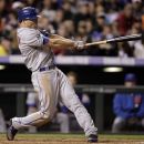 New York Mets' Scott Hairston hits a triple against the Colorado Rockies in the fifth inning of their baseball game in Denver on Friday, April 27, 2012. (AP Photo/Joe Mahoney)