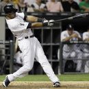 Chicago White Sox's Alex Rios hits a solo home run against the Los Angeles Angels during the sixth inning of a baseball game in Chicago, Friday, Aug. 3, 2012. (AP Photo/Nam Y. Huh)