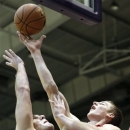 Indiana forward Cody Zeller, right, shoots over Northwestern center Alex Olah during the first half of an NCAA college basketball game in Evanston, Ill., Sunday, Jan. 20, 2013. (AP Photo/Nam Y. Huh)