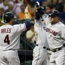 Cleveland Indians' Jason Giambi, right, celebrates his three-run home run against the Houston Astros with teammates Mike Aviles and Mike Aviles in the fourth inning of a baseball game on Saturday, April 20, 2013, in Houston. (AP Photo/Pat Sullivan)