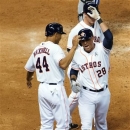 Houston Astros pinch hitter Rick Ankeil (28) celebrates with Justin Maxwell (44) after hitting a three-run home run against the Texas Rangers during the sixth inning of a season-opening baseball game at Minute Maid Park, Sunday, March 31, 2013, in Houston. (AP Photo/Houston Chronicle, Smiley N. Pool)