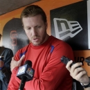 Philadelphia Phillies pitcher Roy Halladay talks about an injury right shoulder as he speaks with the media in the dugout before a baseball game against the San Francisco Giants on Wednesday, May 8, 2013 in San Francisco. He will have arthroscopic surgery to repair a bone spur in his the shoulder. (AP Photo/Marcio Jose Sanchez)