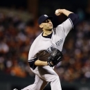 New York Yankees starting pitcher Andy Pettitte throws to the Baltimore Orioles in the first inning of Game 2 of the American League division baseball series on Monday, Oct. 8, 2012, in Baltimore. (AP Photo/Alex Brandon)