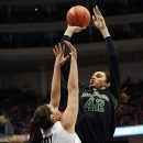 Baylor's Brittney Griner, right, shoots over Connecticut's Stefanie Dolson during the first half of an NCAA college basketball game in Hartford, Conn., Monday, Feb. 18, 2013. (AP Photo/Jessica Hill)