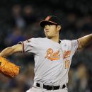 Baltimore Orioles starting pitcher Wei-Yin Chen, of Taiwan, throws against the Seattle Mariners in the third inning of a baseball game, Tuesday, Sept. 18, 2012, in Seattle. (AP Photo/Ted S. Warren)