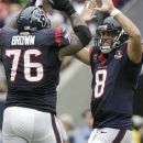 Houston Texans quarterback Matt Schaub (8) and Duane Brown (76) celebrate a touchdown against the Tennessee Titans during the third quarter of an NFL football game between the Houston Texans and the Tennessee Titans Sunday, Sept. 30, 2012, in Houston. (AP Photo/Patric Schneider)