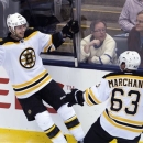 Boston Bruins forward David Krejci, left, celebrates his winning goal past Toronto Maple Leafs goalie James Reimer with forward Brand Marchand, right, during overtime of Game 4 of their NHL hockey Stanley Cup playoff series, Wednesday, May 8, 2013, in Toronto. The Bruins won 4-3. (AP Photo/The Canadian Press, Nathan Denette)