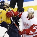 Detroit Red Wings right wing Johan Franzen (93), of Sweden, collides with Nashville Predators defenseman Shea Weber (6) in the first period of Game 1 of a first-round NHL hockey playoff series on Wednesday, April 11, 2012, in Nashville, Tenn. Franzen was called for roughing on the play. (AP Photo/Mark Humphrey)