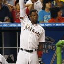 Miami Marlins' Hanley Ramirez cheers as he watches Logan Morrison hit a home run during the seventh inning of a baseball game against the St. Louis Cardinals in Miami, Wednesday, June 27, 2012. The Marlins won 5-3. (AP Photo/J Pat Carter)