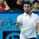 France's Gilles Simon returns the ball to France's Gael Monfils, during their final match, at the Open 13 tennis tournament, in Marseille, southern France, Sunday, Feb. 22 , 2015. (AP Photo/Claude Paris)