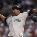 New York Yankees' Ivan Nova delivers a pitch against the Boston Red Sox in the first inning of a baseball game at Fenway Park in Boston, Sunday, July 8, 2012. (AP Photo/Steven Senne)