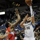 Minnesota Timberwolves' Nikola Pekovic, right, of Montenegro, hoots over Los Angeles Clippers' DeAndre Jordan during the first half of an NBA basketball game on Thursday, Jan. 17, 2013, in Minneapolis. (AP Photo/Jim Mone)