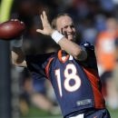 Denver Broncos quarterback Peyton Manning throws during the opening session of Denver Broncos NFL football training camp in Englewood, Colo., Thursday, July 26, 2012. (AP Photo/Jack Dempsey)