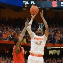 Syracuse's James Southerland shoots over St. John's Phil Greene during the second half of an NCAA college basketball game in Syracuse, N.Y., Sunday, Feb. 10, 2013. Syracuse won 77-58. (AP Photo/Kevin Rivoli)