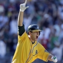 Oakland Athletics' Nate Freiman celebrates after hitting the game-winning RBI single off New York Yankees pitcher Mariano Rivera in the 18th inning of a baseball game Thursday, June 13, 2013 in Oakland, Calif. Oakland won 3-2 in 18 innings. (AP Photo/Eric Risberg)