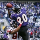 FILE - In this Jan. 15, 2012 file photo, Baltimore Ravens free safety Ed Reed intercepts a pass intended for Houston Texans wide receiver Andre Johnson during the second half of an NFL divisional playoff football game in Baltimore. The Houston Texans will meet with free agent Reed on Thursday, March 14, 2013. The team said on its Twitter site that general manager Rick Smith is flying to pick up Reed in a private jet owned by team owner Bob McNair.  (AP Photo/Patrick Semansky, File)